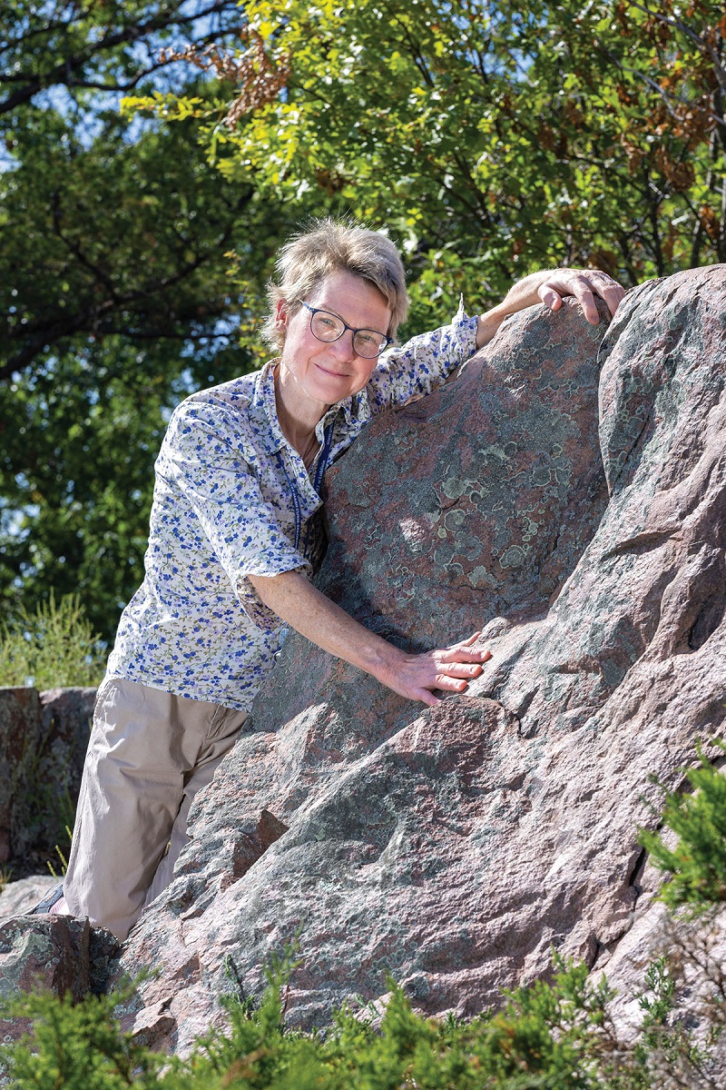 Lawrence University geosciences professor Marcia Bjornerud at the Poppy’s Rock Natural State Area in New London.