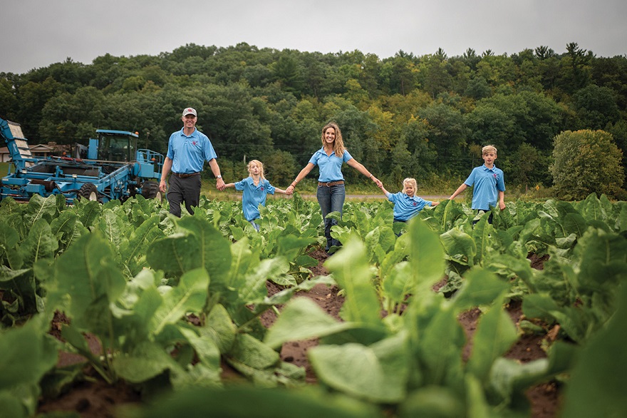 Huntsinger Farms, founded in 1929 by German emigrant Ellis Huntsinger, is now run by Huntsinger’s great-grandson, Eric Rygg (pictured here with his family), who serves as president. The company is owned by Eric Rygg, his brother, and his mother (Ellis Huntsinger’s granddaughter).